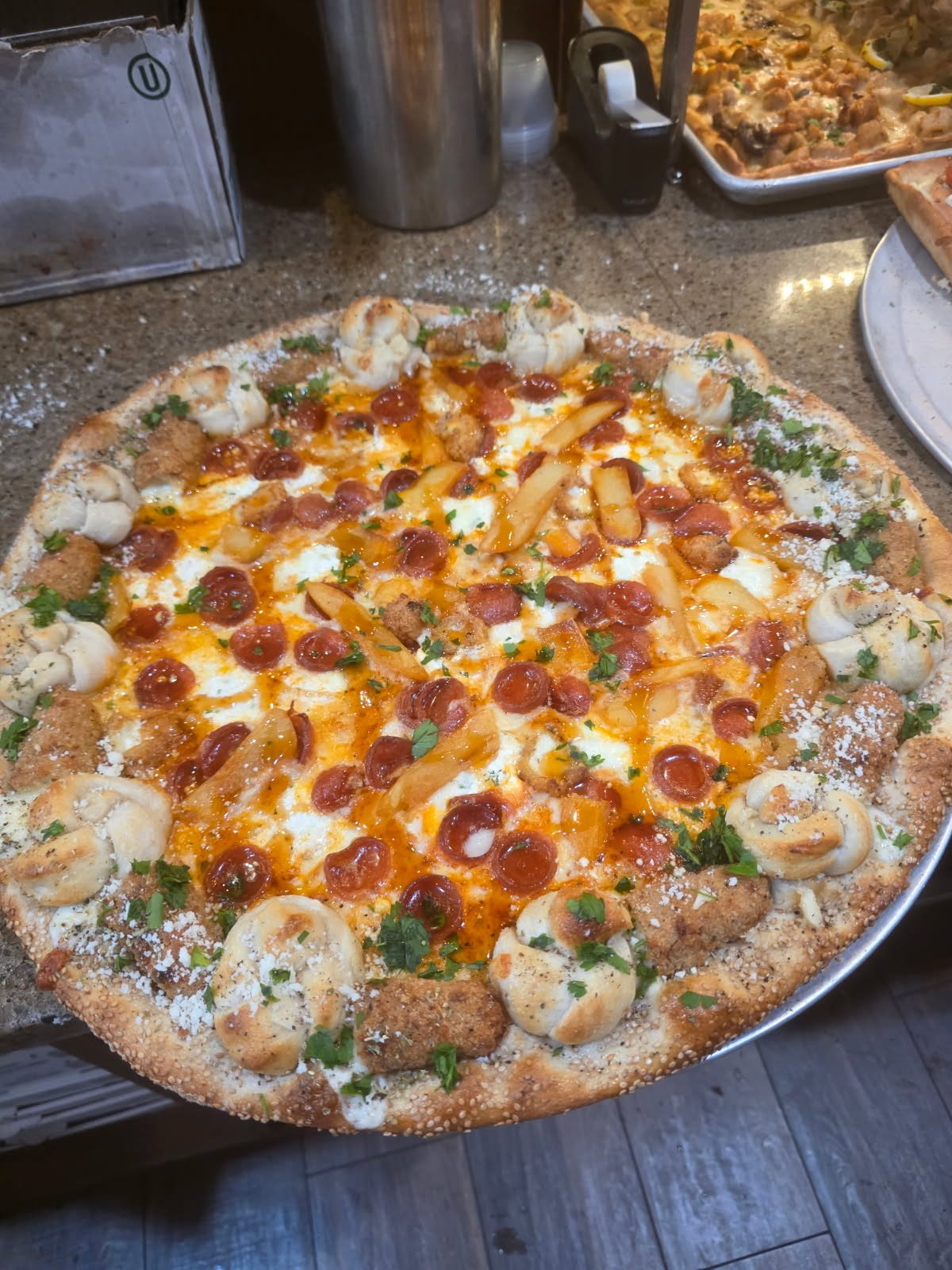 Pizza with shrimp, pepperoni and a ring of crust bites
